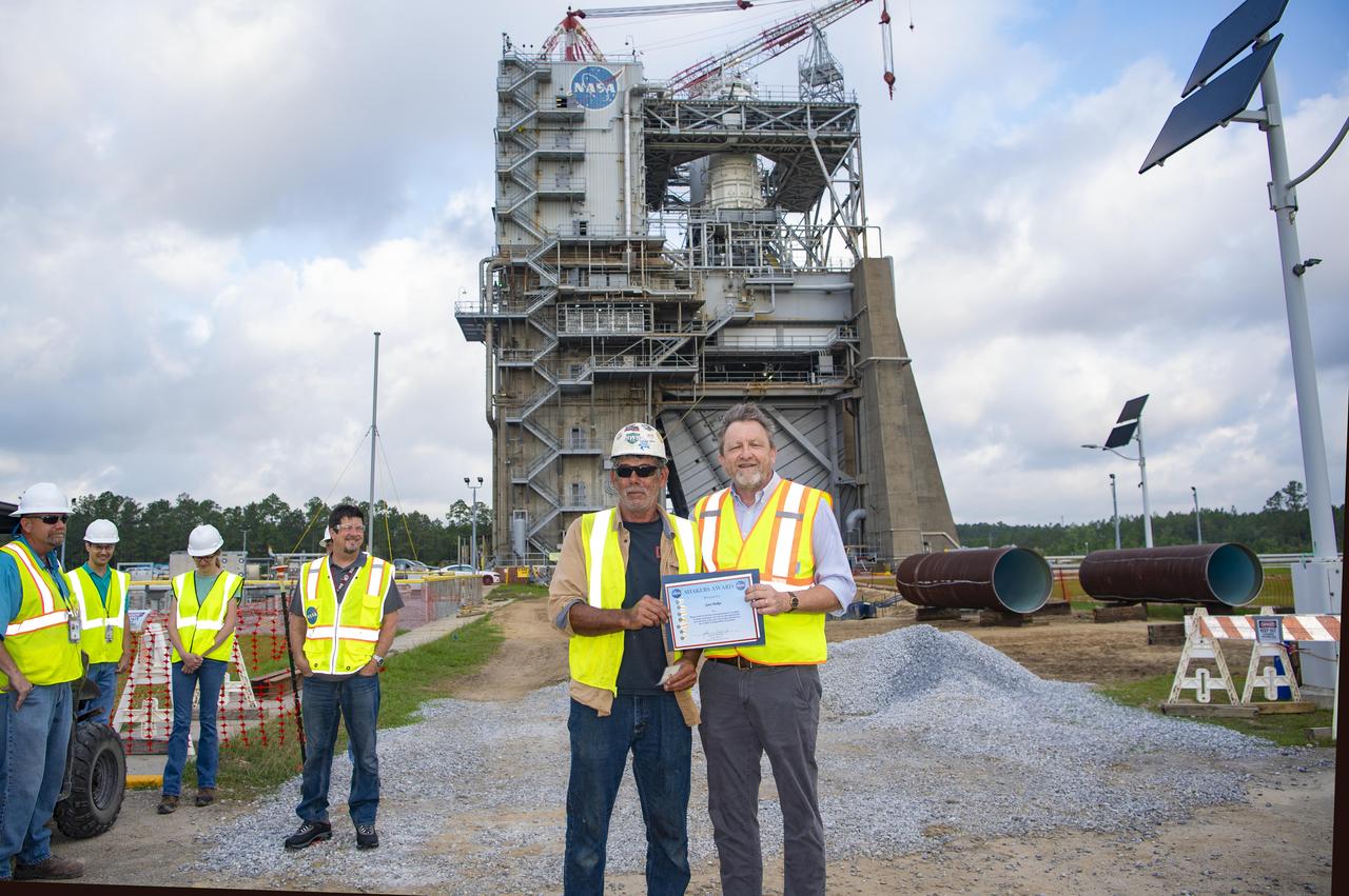 : Gary Parker, an employee with Healtheon, Inc., is presented a NASA SHAKERS (Smart Human Actions Keep Everyone Really Safe) Award from NASA Stennis Associate Director Rodney McKellip on May 8. Parker, left, received the award for leadership and dedication to safety of the crew working to upgrade an essential test complex water system at NASA Stennis. As one of the crew leaders, Parker ensured all took the safest approach for each task, even as the scale of the project increased. NASA’s constant attention to safety, one of the agency’s five core values, is the cornerstone for mission success.