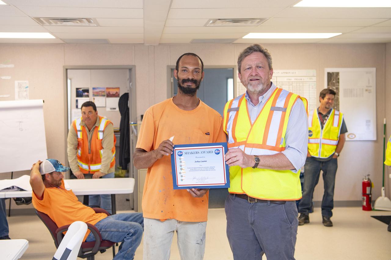 Joshua Laurent, an employee with Civil Works Contracting, is presented a NASA SHAKERS (Smart Human Actions Keep Everyone Really Safe) Award from NASA Stennis Associate Director Rodney McKellip on May 8. Laurent, left, received the award for continuously demonstrating safe work habits, utilizing the proper personal protective equipment for each task, and always considering environmental factors and hazards within the work area while working on the NASA Stennis potable water system. NASA’s constant attention to safety, one of the agency’s five core values, is the cornerstone for mission success. 