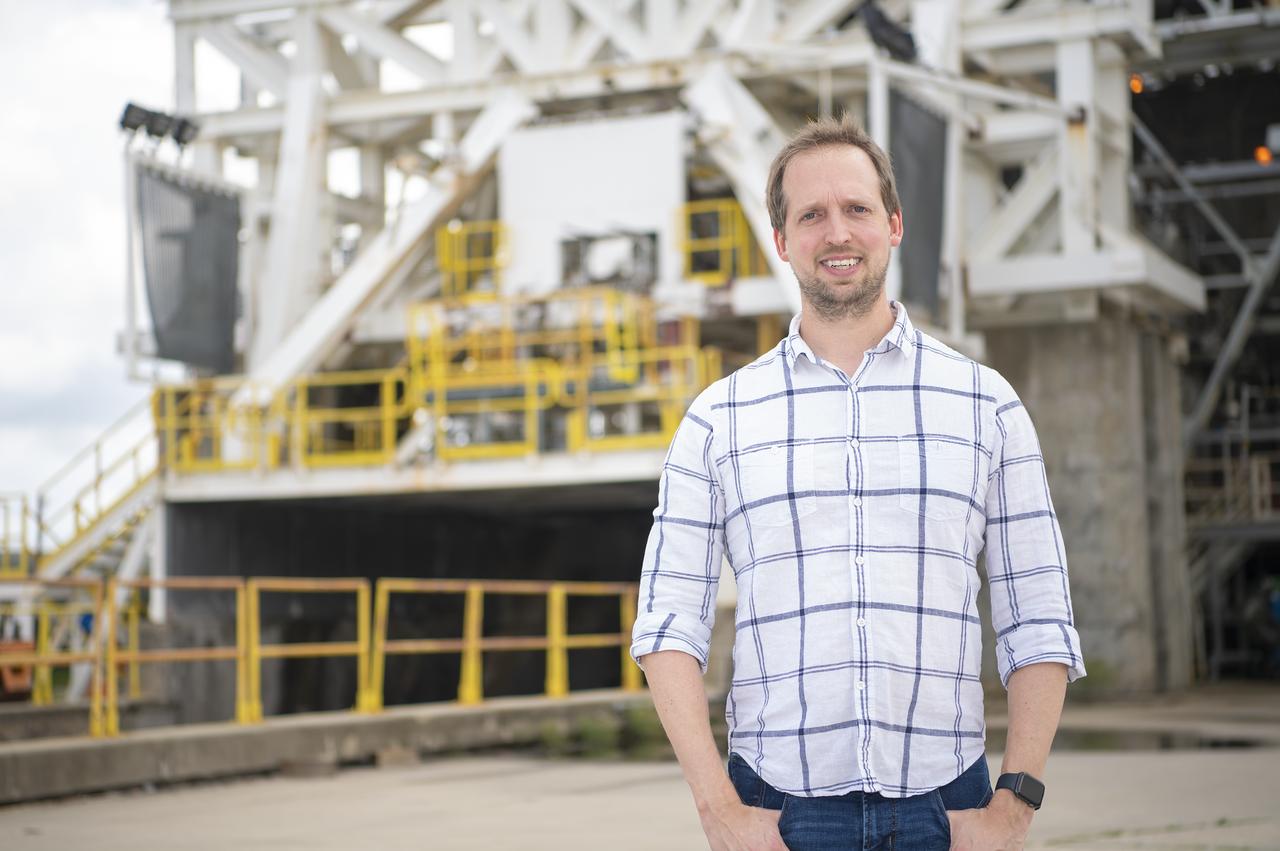 Chris Barnett-Woods is shown at the E-1 Test Stand at NASA’s Stennis Space Center near Bay St. Louis, Mississippi, where NASA Stennis accelerates the exploration and commercialization of space and innovates to benefit NASA and industry.