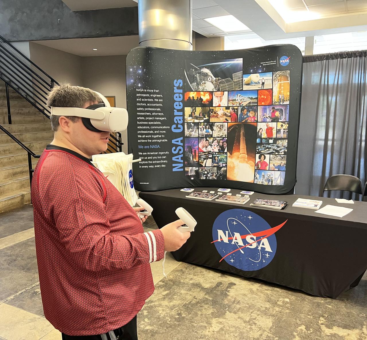 A Jackson, Mississippi, Star Trek fan club, USS Haise member, volunteers to be the first user of the virtual reality experience provided by NASA Stennis before the Mississippi Comic Convention begins.