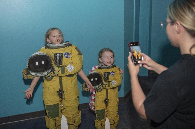 Two young visitors to the Audubon Aquarium in New Orleans pose as NASA astronauts as part of a NASA exhibit July 5. NASA hosted an information/interactive exhibit at the aquarium in conjunction with NASA activities at the 30th annual ESSENCE Fest in New Orleans during the Fourth of July weekend.