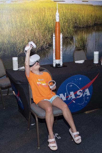 An Audubon Aquarium visitor in New Orleans experiences a virtual reality visit to the International Space Station as part of a NASA exhibit on July 5. NASA hosted an information/interactive exhibit at the aquarium in conjunction with NASA activities at the 30th annual ESSENCE Fest in New Orleans during the Fourth of July weekend.