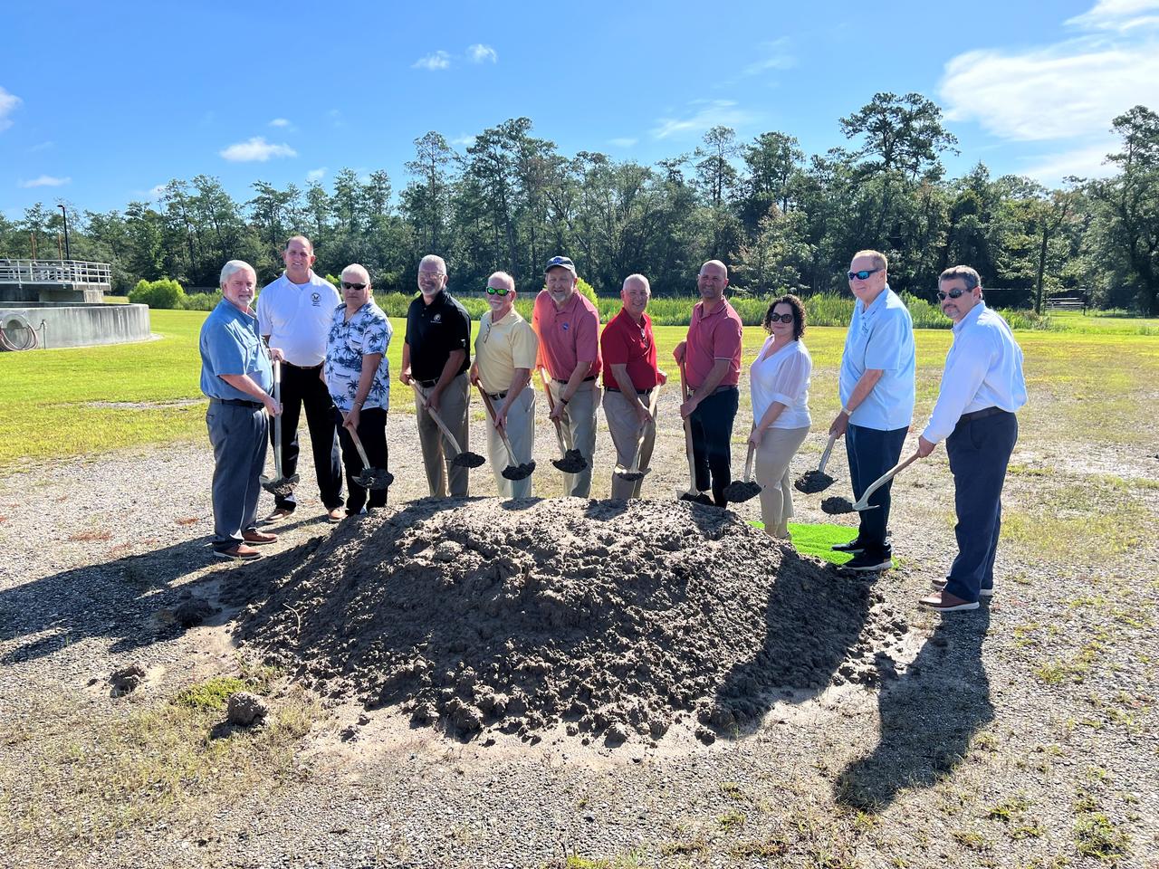 NASA Stennis breaks ground with officials from Hancock County on July 18 for the Stennis Wastewater Conveyance Project at the Northern Wastewater Treatment Plant in Kiln, Mississippi. The groundbreaking represented launch of an agreement described as a win-win situation for Hancock County and NASA Stennis. Upon completion of the project, the county will assume responsibility for servicing wastewater from the NASA center. The new agreement will enable the county to utilize its existing facility more efficiently, while also allowing NASA Stennis to devote more center resources its mission work. Groundbreaking participants include (left to right): Hancock County supervisor Chuck Clark, District 3; Hancock County supervisor Bo Ladner, District 5; Hancock County Water & Sewer District Chair Farron Hoda; state Rep. Brent Anderson, Mississippi District 122; Mayor Mike Favre, Bay St. Louis, Mississippi; NASA Stennis Associate Director Rodney McKellip; Hancock County Board President Scotty Adam (District 4 supervisor); state Sen. Philman Ladner, Mississippi District 46; NASA Stennis project manager Brittany Bouche; Mayor Jay Trapani, Waveland, Mississippi; and Hancock County Utility Authority Executive Director David Pitalo.