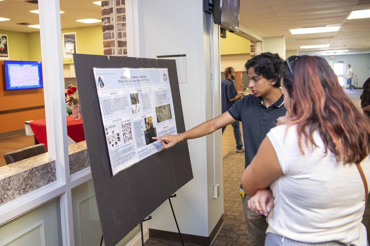 NASA Stennis summer intern Lekh Patel shares about his work on lunar communications during an Aug. 7 event hosted by the Office of STEM Engagement. Patel, a student at Rutgers University in Newark, New Jersey, worked with the NASA Stennis Autonomous Systems Laboratory. The poster symposium highlighted research topics, including propulsion test operations, lunar robotics, autonomous systems, STEM education, and more. NASA’s Office of STEM Engagement paid internships allow high school and college-level students to contribute to the agency’s mission to advance science, technology, aeronautics, and space exploration.