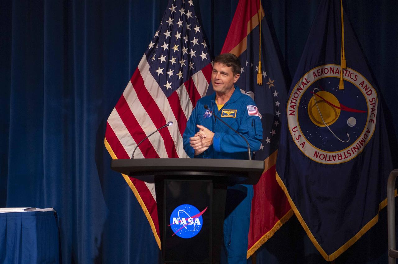 NASA astronaut Reid Wiseman speaks to employees and guests before presenting the Silver Snoopy awards on Aug. 21 at NASA’s Stennis Space Center. The Silver Snoopy is the astronauts’ personal award and is presented to less than 1 percent of the total NASA workforce annually. Wiseman will be one of four astronauts flying around the Moon on Artemis II, the first crewed mission on NASA’s path toward long-term scientific lunar exploration. The 10-day flight will test NASA’s foundational human deep space exploration capabilities, the agency’s powerful SLS (Space Launch System) rocket, and the Orion spacecraft for the first time with astronauts. The RS-25 engines helping to power SLS were tested at NASA Stennis.