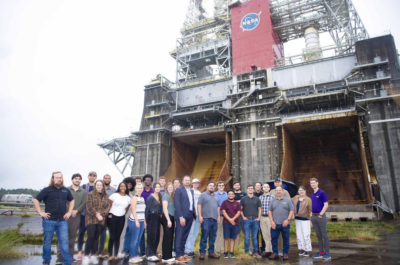 Members of the Society for the Advancement of Material and Process Engineering at Louisiana State University stand at the Thad Cochran Test Stand during a visit to NASA Stennis on Oct. 4. The Thad Cochran Test Stand (B-2) is where future Green Run testing of NASA’s exploration upper stage will take place ahead of future Artemis missions to the Moon and beyond. The mission of the Society for the Advancement of Material and Process Engineering at LSU is to provide enhanced educational opportunities by delivering information on new and advanced materials and processing technology.