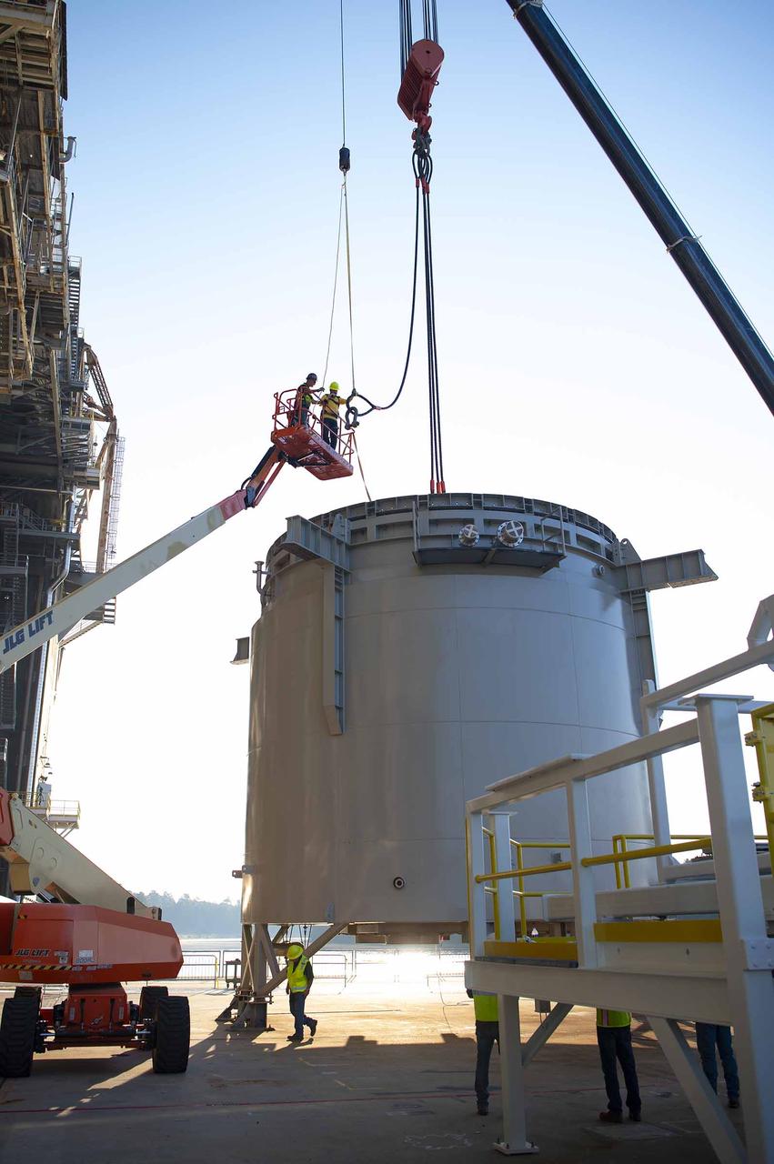Teams at NASA’s Stennis Space Center complete a safe lift and install of an interstage simulator unit needed for future testing of NASA’s exploration upper stage (EUS) in the B-2 position of the Thad Cochran Test Stand. The lift and install, completed over a two-week period that began Oct. 10, marks a milestone for testing the new SLS (Space Launch System) rocket stage that will fly on future Artemis missions to the Moon and beyond. The EUS will undergo a series of Green Run tests of its integrated systems prior to its first flight. During testing, the interstage simulator component will function like the SLS interstage section that helps protect the upper stage during Artemis launches.