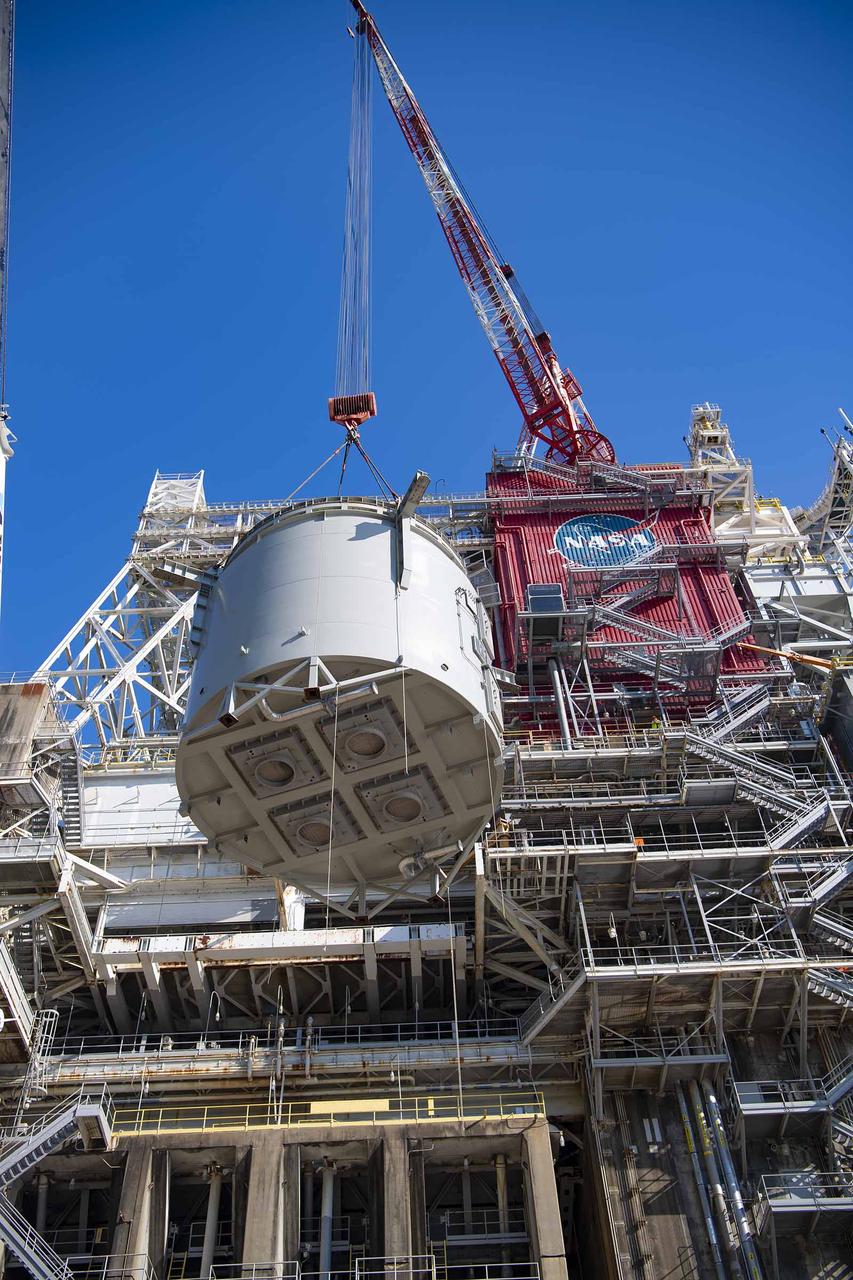 Teams at NASA’s Stennis Space Center complete a safe lift and install of an interstage simulator unit needed for future testing of NASA’s exploration upper stage (EUS) in the B-2 position of the Thad Cochran Test Stand. The lift and install, completed over a two-week period that began Oct. 10, marks a milestone for testing the new SLS (Space Launch System) rocket stage that will fly on future Artemis missions to the Moon and beyond. The EUS will undergo a series of Green Run tests of its integrated systems prior to its first flight. During testing, the interstage simulator component will function like the SLS interstage section that helps protect the upper stage during Artemis launches.