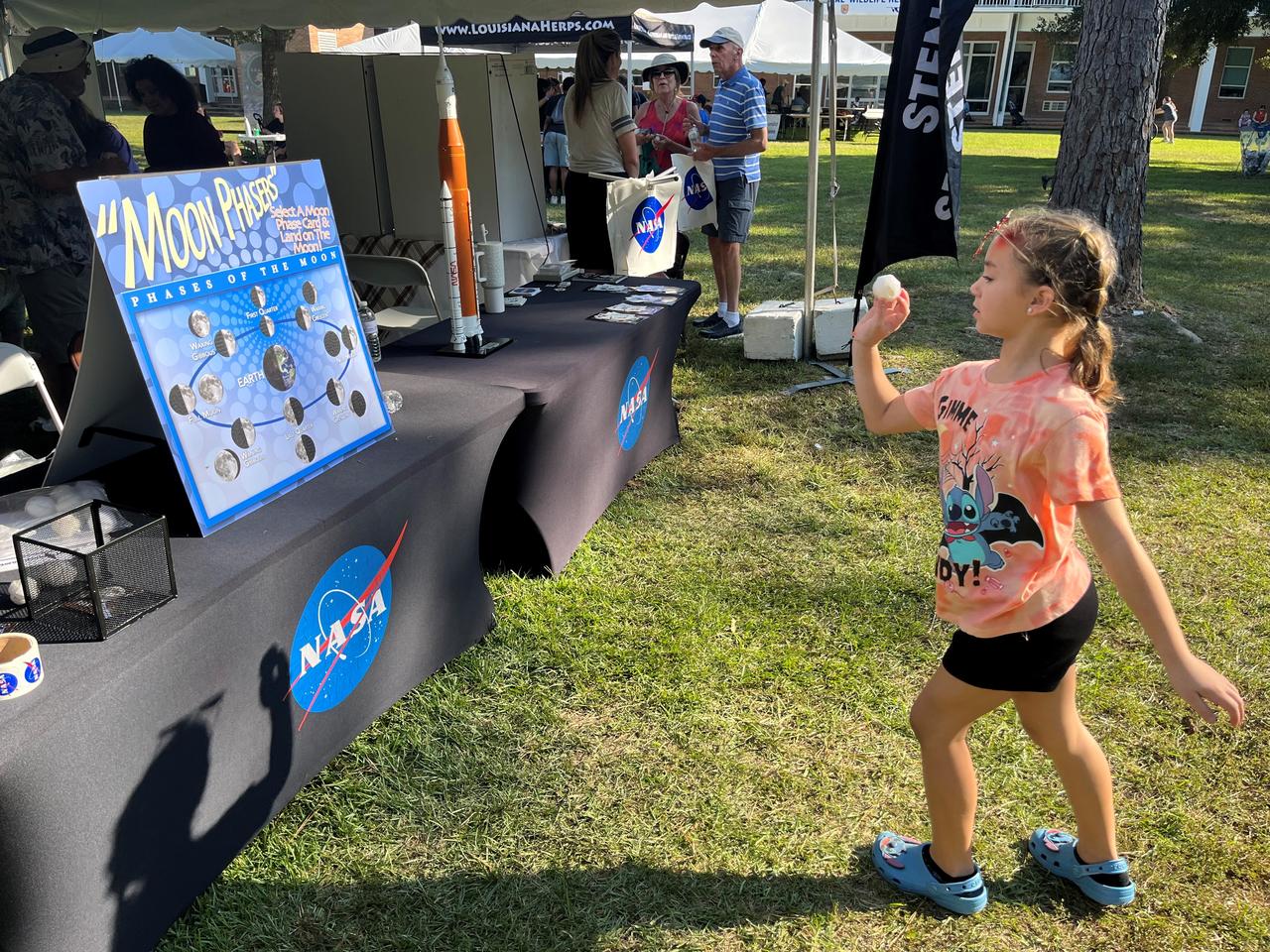 NASA Stennis representatives inspire the Artemis Generation Oct. 12 at the Wild Things event celebrating National Wildlife Refuge Week in Lacombe, Louisiana. Participants played a game to identify different phases of the Moon and learned more about NASA’s return to the Moon. The event was hosted by Friends of Louisiana Wildlife Refuges, Inc. and Southeast Louisiana National Wildlife Refuges Complex at Bayou Lacombe Center, headquarters for the nine National Wildlife Refuges in southeast Louisiana.