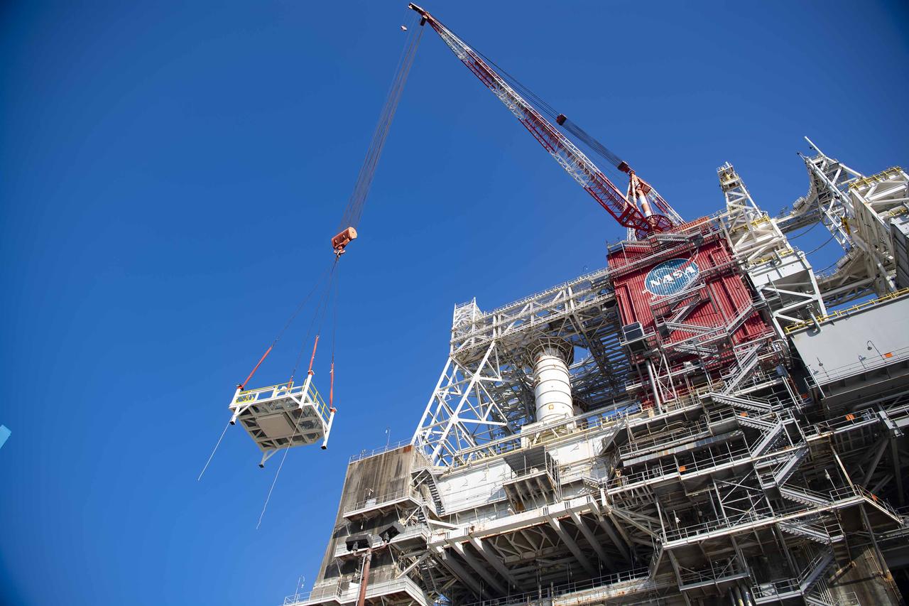 A pair of umbilical support structures needed for future testing of NASA’s exploration upper stage (EUS) were installed in the B-2 position of the Thad Cochran Test Stand on Oct. 30-31 at NASA’s Stennis Space Center.  The support structures arrived from NASA’s Michoud Assembly Facility in New Orleans via the unique NASA Stennis seven-and-a-half-mile canal system in 2023. Since then, crews have prepared the structures that will align with the EUS unit for installation. In addition to helping secure the unit in place during hot fire testing, the umbilical support structures are where the command, control, and data electrical connections are mated to connect the ground systems to the vehicle systems, as well as most the commodity connections such as liquid hydrogen, liquid oxygen, hydrogen vent, helium bottle fill pressure, and purges.  Prior to its initial flight, the EUS unit will undergo a series of so-called Green Run tests at NASA Stennis to ensure all systems are ready to go. The test series will culminate with a hot fire of the stage’s four RL10 engines, made by Aerojet Rocketdyne, an L3Harris Technologies company and lead SLS engines contractor. The new upper stage will enable NASA to carry larger payloads on Artemis missions to the Moon and beyond.
