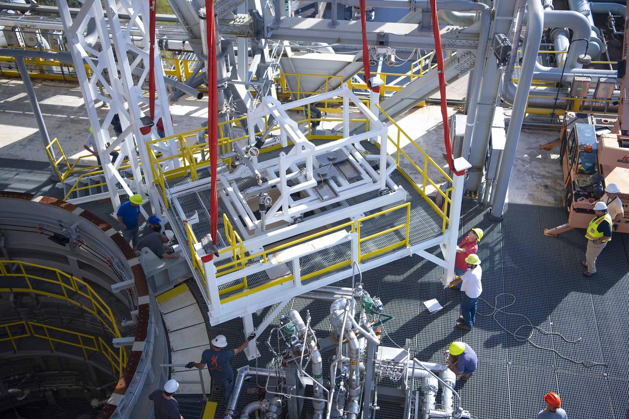 A pair of umbilical support structures needed for future testing of NASA’s exploration upper stage (EUS) were installed in the B-2 position of the Thad Cochran Test Stand on Oct. 30-31 at NASA’s Stennis Space Center.  The support structures arrived from NASA’s Michoud Assembly Facility in New Orleans via the unique NASA Stennis seven-and-a-half-mile canal system in 2023. Since then, crews have prepared the structures that will align with the EUS unit for installation. In addition to helping secure the unit in place during hot fire testing, the umbilical support structures are where the command, control, and data electrical connections are mated to connect the ground systems to the vehicle systems, as well as most the commodity connections such as liquid hydrogen, liquid oxygen, hydrogen vent, helium bottle fill pressure, and purges.  Prior to its initial flight, the EUS unit will undergo a series of so-called Green Run tests at NASA Stennis to ensure all systems are ready to go. The test series will culminate with a hot fire of the stage’s four RL10 engines, made by Aerojet Rocketdyne, an L3Harris Technologies company and lead SLS engines contractor. The new upper stage will enable NASA to carry larger payloads on Artemis missions to the Moon and beyond.