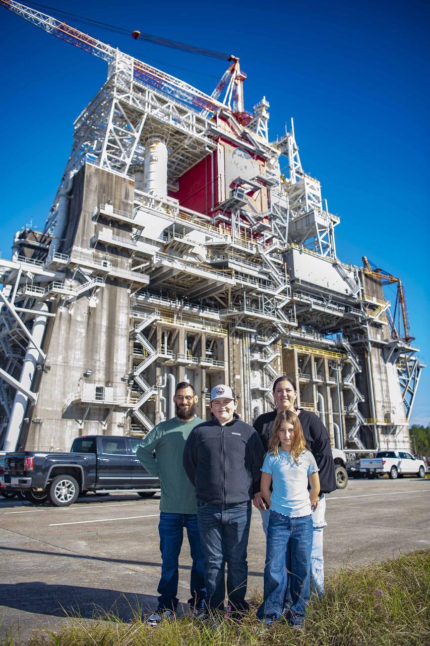 Cookbook author and culinary content creator Caroline Davis, popularly known as Mississippi Kween, and her family enjoy touring facilities and learning about NASA Stennis and its frontline work during a site visit Dec. 18. Davis, husband Joe, and children Zeke and Zoey, met with NASA Stennis leadership before touring the L3Harris (formerly Aerojet Rocketdyne) Engine Assembly Facility, Thad Cochran Test Stand, Autonomous Systems Laboratory, and the NASA Stennis rocket engine garden. The tour highlighted the NASA Stennis story and how the south Mississippi NASA center has the ingredients for a recipe that accelerates the exploration and commercialization of space, innovates to benefit NASA and industry, and leverages assets to stimulate the economy.