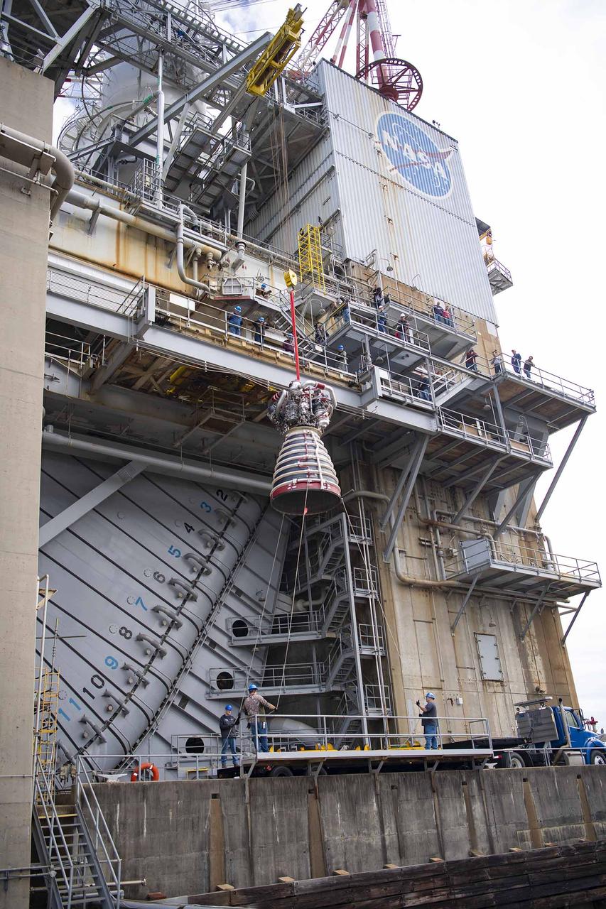 Teams at NASA’s Stennis Space Center deliver, lift, and install the first new production RS-25 engine on the Fred Haise Test Stand on Feb. 18.