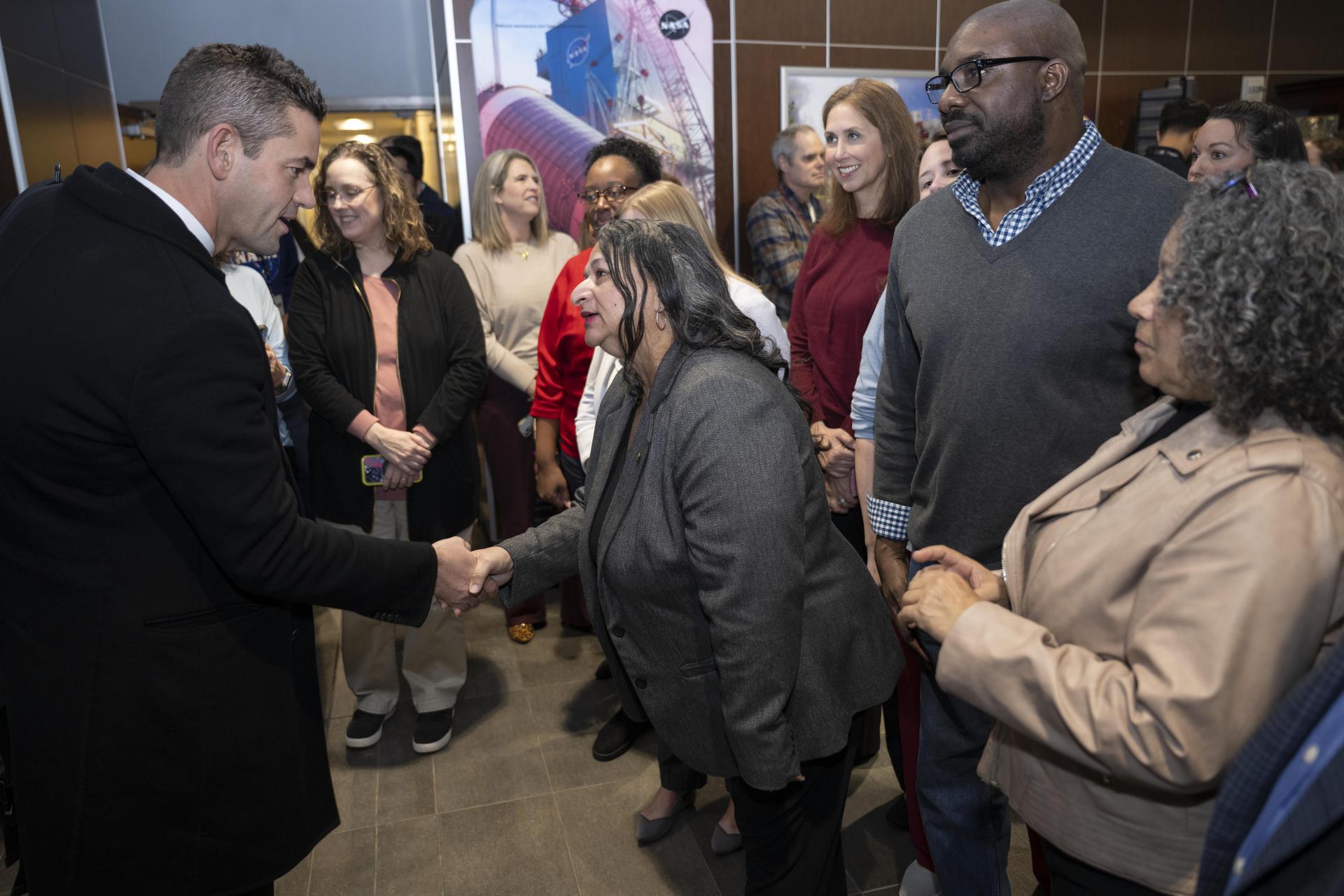 NASA Administrator Jared Isaacman, left, meets with NASA employees during his visit to NASA’s Stennis Space Center near Bay St. Louis, Mississippi, on Jan. 15, 2026. Isaacman, NASA’s 15th administrator, began visiting the agency’s centers after his appointment on Dec. 17, 2025.