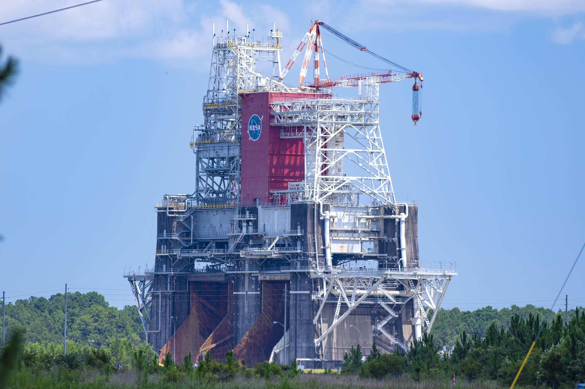 An image shows the Thad Cochran Test Stand (B-1/B-2) at NASA’s Stennis Space Center near Bay St. Louis, Mississippi, on July 7. The test stand features dual, vertical firing positions built in the 1960s to test Saturn V rocket stages that carried humans to the Moon during the Apollo program. The B 1 position, right, is equipped for single engine tests, while the B 2 position is designed to test full rocket stages.