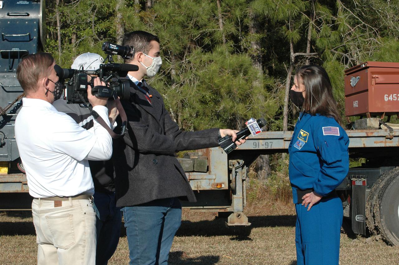 Astronaut Tracy Caldwell Dyson speaks with media representatives prior to the Green Run hot fire test of the core stage for NASA’s Space Launch System (SLS) rocket at Stennis Space Center near Bay St. Louis, Mississippi, on Saturday, January 16, 2021. NASA conducted a hot fire test of the core stage’s four RS-25 engines on the B-2 Test Stand at Stennis. Scheduled for as long as eight minutes, the engines fired for a little more than one minute to generate a combined 1.6 million pounds of thrust, just as will occur during an actual launch. The hot fire is the final test of the Green Run test series, a comprehensive assessment of the SLS core stage prior to launching the Artemis I mission to the Moon.