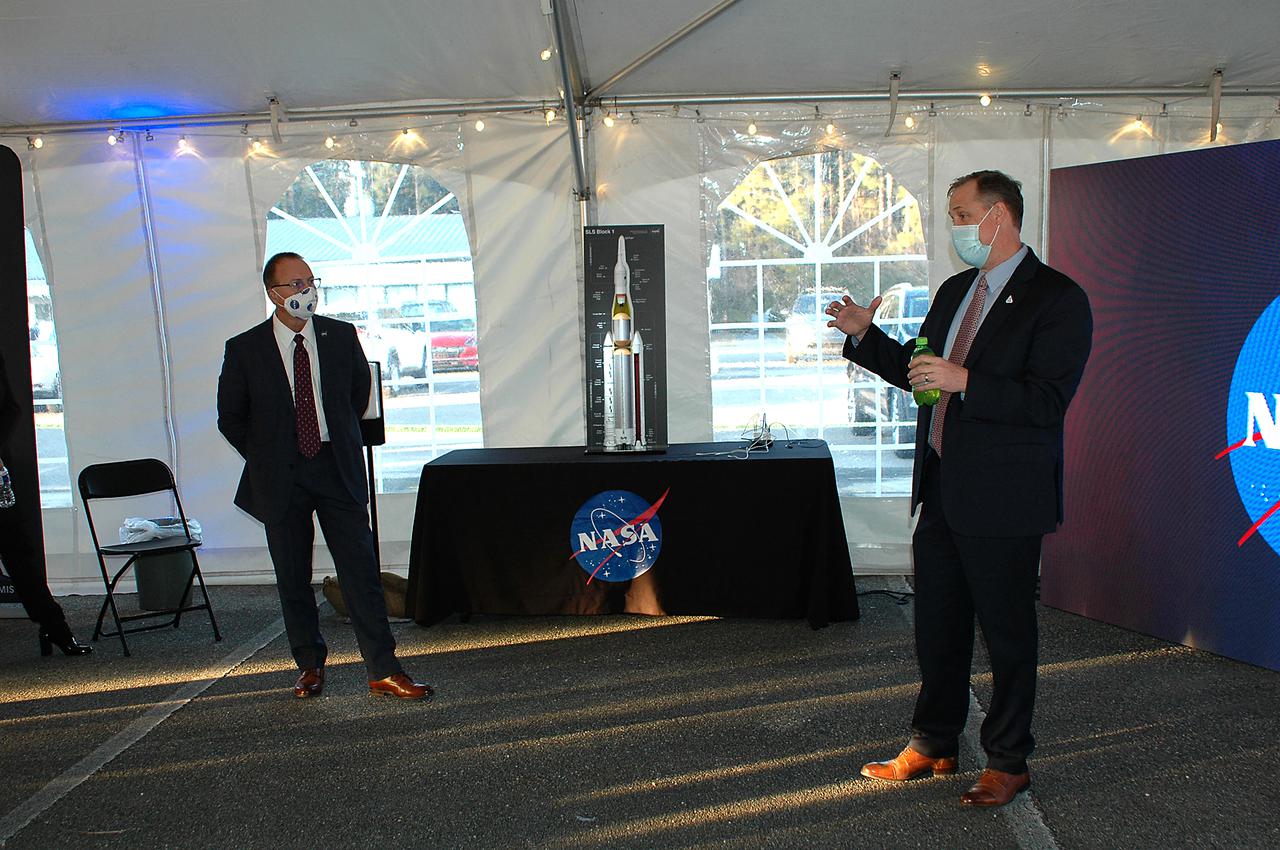 Outgoing NASA Administrator Jim Bridenstine (right), as Stennis Director Rick Gilbrech looks on, speaks to guests following the Green Run hot fire test of the core stage for NASA’s Space Launch System (SLS) rocket at Stennis Space Center near Bay St. Louis, Mississippi, on Saturday, January 16, 2021. NASA conducted a hot fire test of the core stage’s four RS-25 engines on the B-2 Test Stand at Stennis. Scheduled for as long as eight minutes, the engines fired for a little more than one minute to generate a combined 1.6 million pounds of thrust, just as will occur during an actual launch. The hot fire is the final test of the Green Run test series, a comprehensive assessment of the SLS core stage prior to launching the Artemis I mission to the Moon.