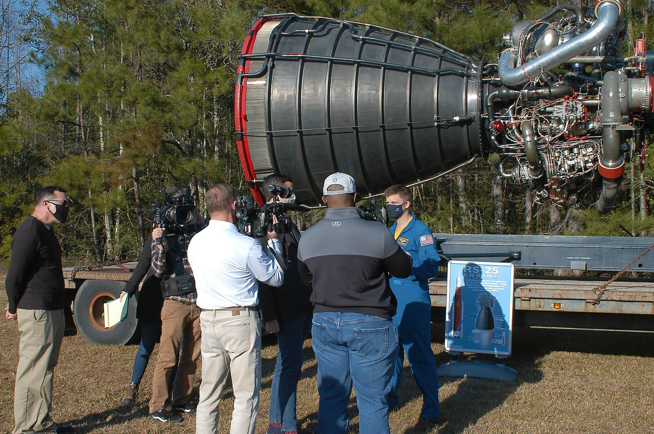Astronaut Matthew Dominick speaks with media representatives prior to the Green Run hot fire test of the core stage for NASA’s Space Launch System (SLS) rocket at Stennis Space Center near Bay St. Louis, Mississippi, on Saturday, January 16, 2021. NASA conducted a hot fire test of the core stage’s four RS-25 engines on the B-2 Test Stand at Stennis. Scheduled for as long as eight minutes, the engines fired for a little more than one minute to generate a combined 1.6 million pounds of thrust, just as will occur during an actual launch. The hot fire is the final test of the Green Run test series, a comprehensive assessment of the SLS core stage prior to launching the Artemis I mission to the Moon.