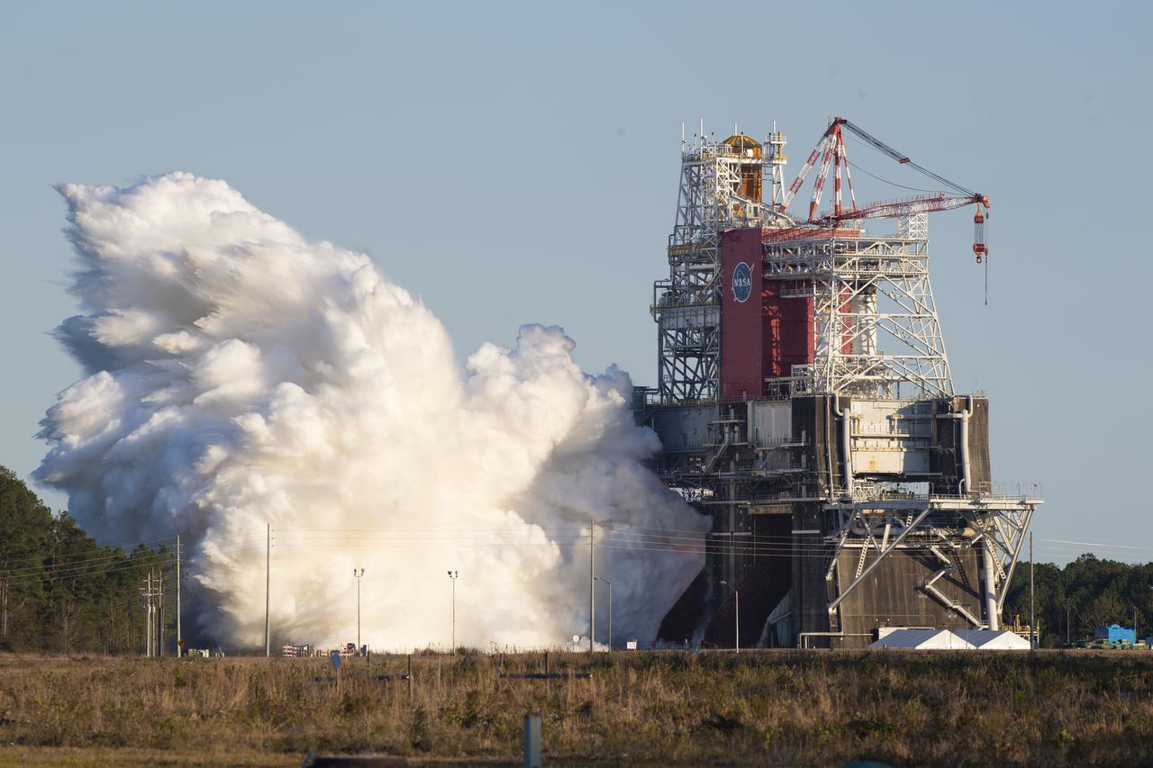 NASA conducts a hot fire test Jan. 16, 2021, of the core stage for the agency’s Space Launch System rocket on the B-2 Test Stand at Stennis Space Center near Bay St. Louis. The hot fire test of the stage’s four RS-25 engines generated a combined 1.6 million pounds of thrust, just as will occur during an actual launch. The hot fire is the final test of the Green Run test series, a comprehensive assessment of the SLS core stage prior to launching the Artemis I mission to the Moon.