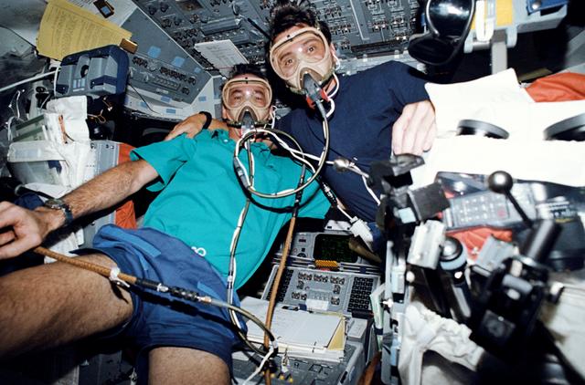 NASA image: STS-46 MS Hoffman & MS Chang-Diaz wear masks during pre-breathe on OV-104