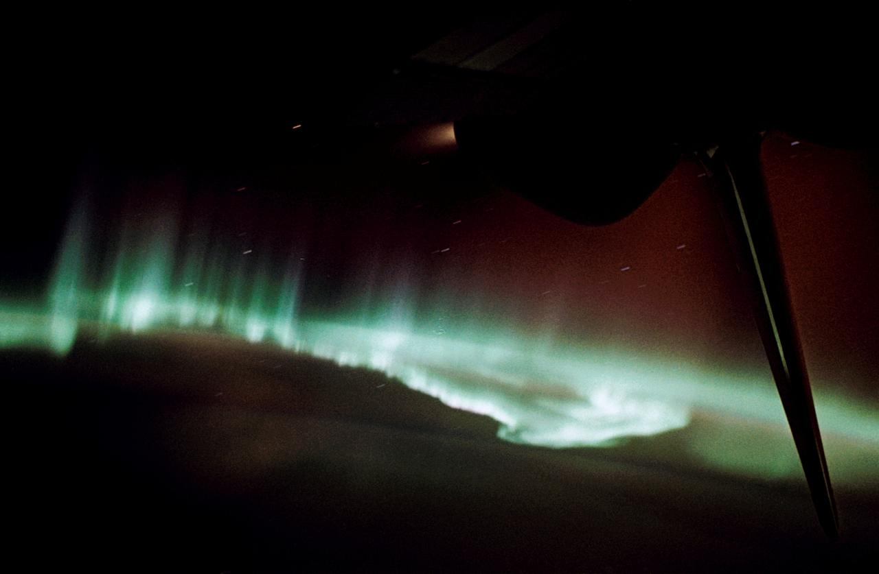 STS059-58-018 (9-20 April 1994) --- Part of the Space Shuttle Endeavour and its Space Radar Laboratory (SRL-1) payload are backdropped against a colorful display of the Southern Lights (aurora australis). The vehicle was firing a reaction control subsystem thruster (below center) when the 35mm image was exposed.