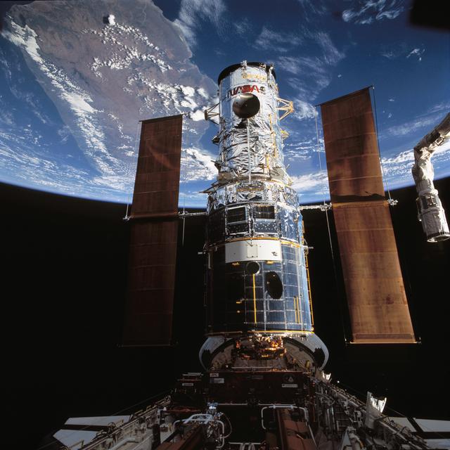 NASA image: Hubble Space Telescope is berthed in Endeavour's payload bay after capture