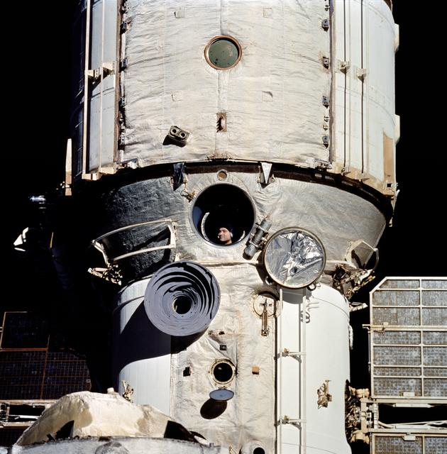 NASA image: Cosmonaut Valeriy Polyakov seen in Mir's window from Shuttle Discovery