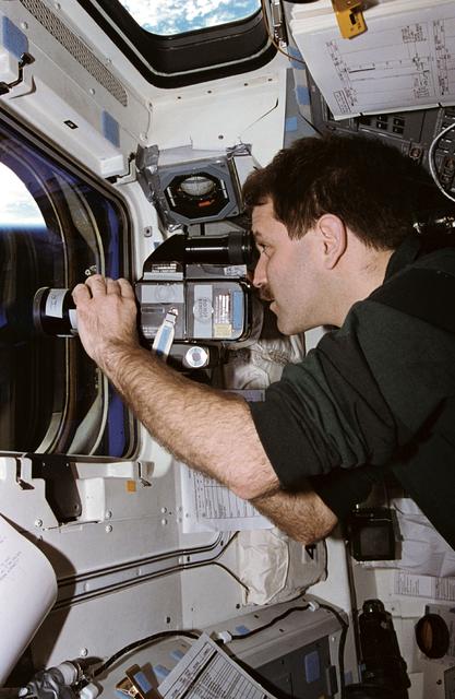 NASA image: Astronaut John Grunsfeld uses camera to record ASTRO-2 payload