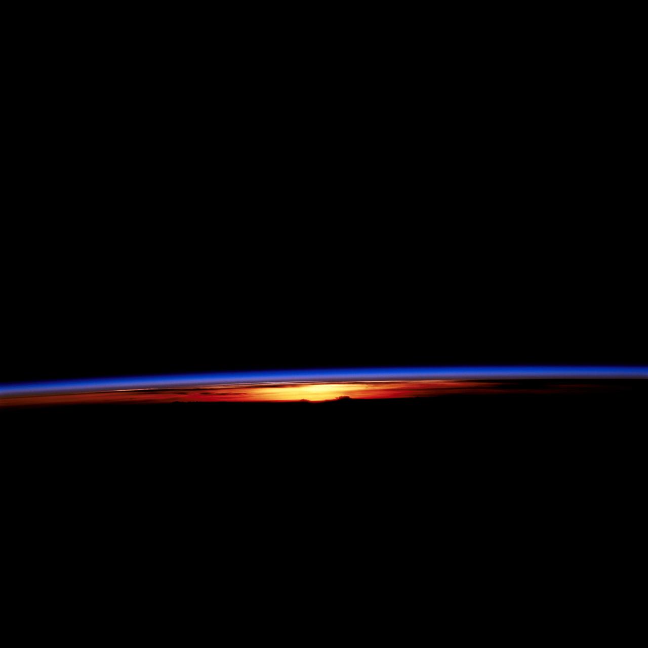 STS067-709-007 (2-18 March 1995) --- This shot, taken just after sunset, shows several distinct layers of gases in the atmosphere on the Earth&#0146;s limb. The distinct colors formed by the amount of scattered light that passes through these gases.