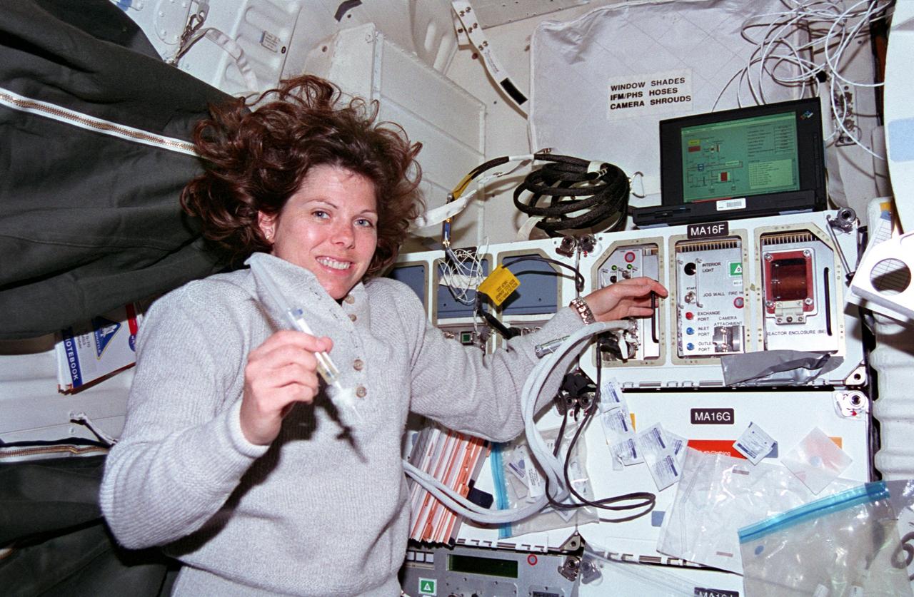 STS070-301-025 (13-22 July 1995) --- Astronaut Mary Ellen Weber works with a syringe related to the Bioreactor Development System (BDS). The almost weightless state of space travel provides life science researchers with the opportunity to grow cells into three-dimensional tissue pieces that are not achievable using conventional tissue culture methods on Earth. At specified times during the STS-70 mission, crew members injected color producing substances to document fluid movement in the reactor, and various-sized beads to estimate the tissue size that could be supported in the Bioreactor. The photo was among NASA's first release of still photography from the STS-70 mission. The mission was launched from the Kennedy Space Center (KSC) on July 13, 1995, and ended when Discovery landed on Runway 33 there on July 22, 1995. The crew members were astronauts Terence T. (Tom) Henricks, commander; Kevin R. Kregel, pilot; and Donald A. Thomas, Nancy J. Currie and Weber, all mission specialists.