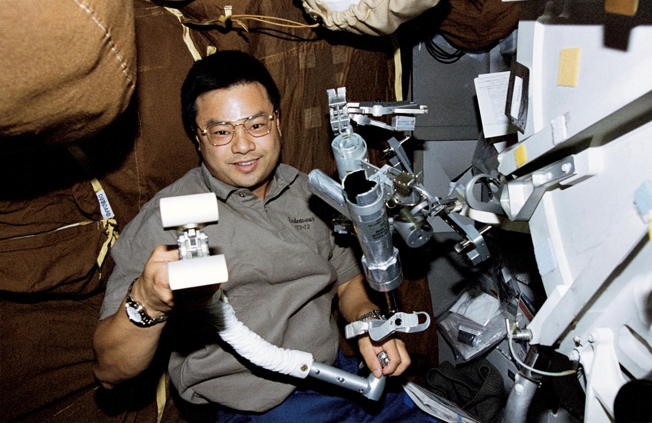 STS072-320-004 (11-20 Jan. 1996) --- On the Space Shuttle Endeavour's middeck, astronaut Leroy Chiao checks equipment for his upcoming extravehicular activity (EVA). Chiao later joined astronaut Daniel T. Barry for the first of two EVA sessions.