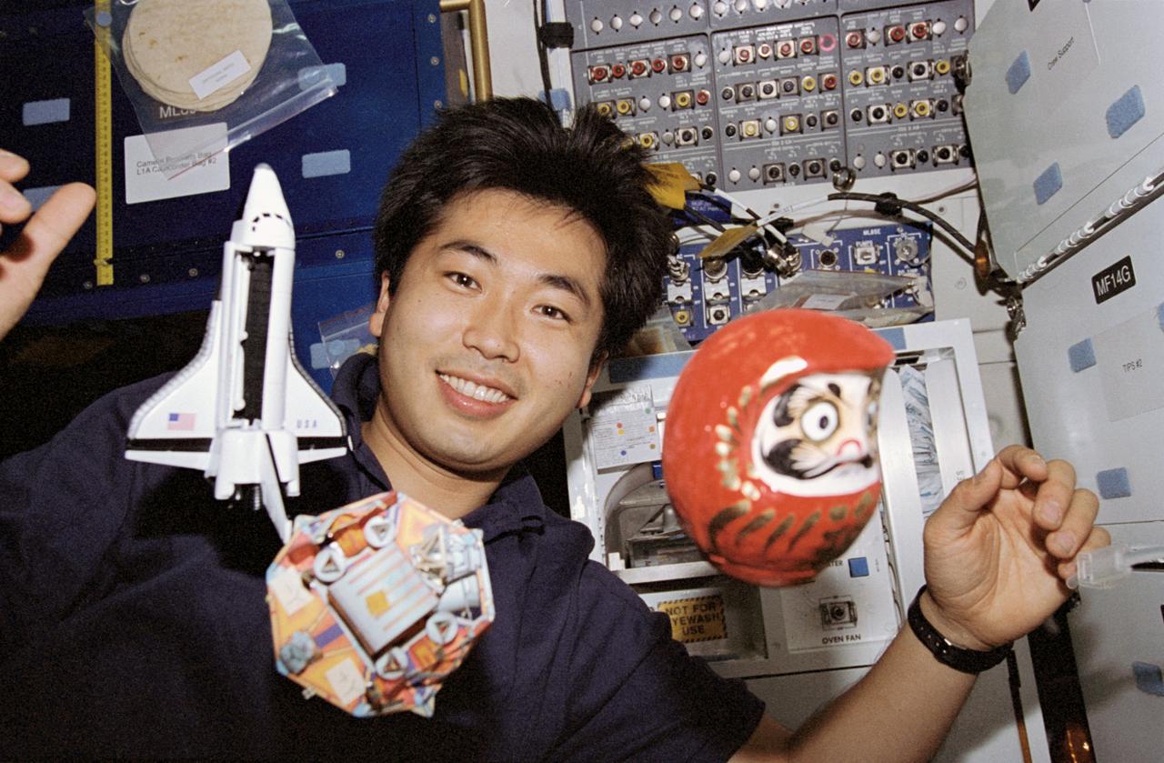 STS072-330-024 (11-20 Jan. 1996) --- During his off-duty time onboard the Space Shuttle Endeavour, astronaut Koichi Wakata finds it a simple task to juggle objects in a microgravity environment. Wakata represented Japan's National Development Space Agency (NASDA) on the flight. The Japanese Space Flyer Unit (SFU) and the Space Shuttle Endeavour models are joined in the juggling act by a daruma, a ceremonial Japanese doll.