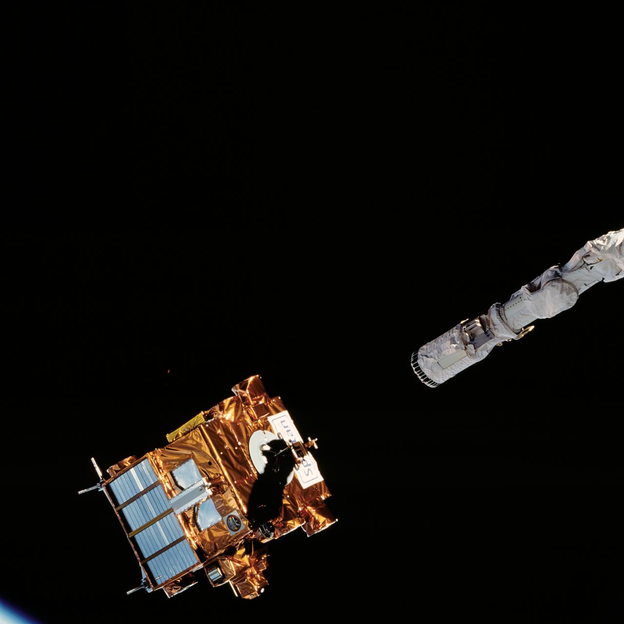 STS072-726-051 (15 Jan. 1996) --- The Office of Aeronautics and Space Technology (OAST) Flyer satellite begins its period of free flight, as it is let go by the end effector of the Space Shuttle Endeavour's Remote Manipulator System (RMS).  The crewmembers retrieved the satellite two days later.