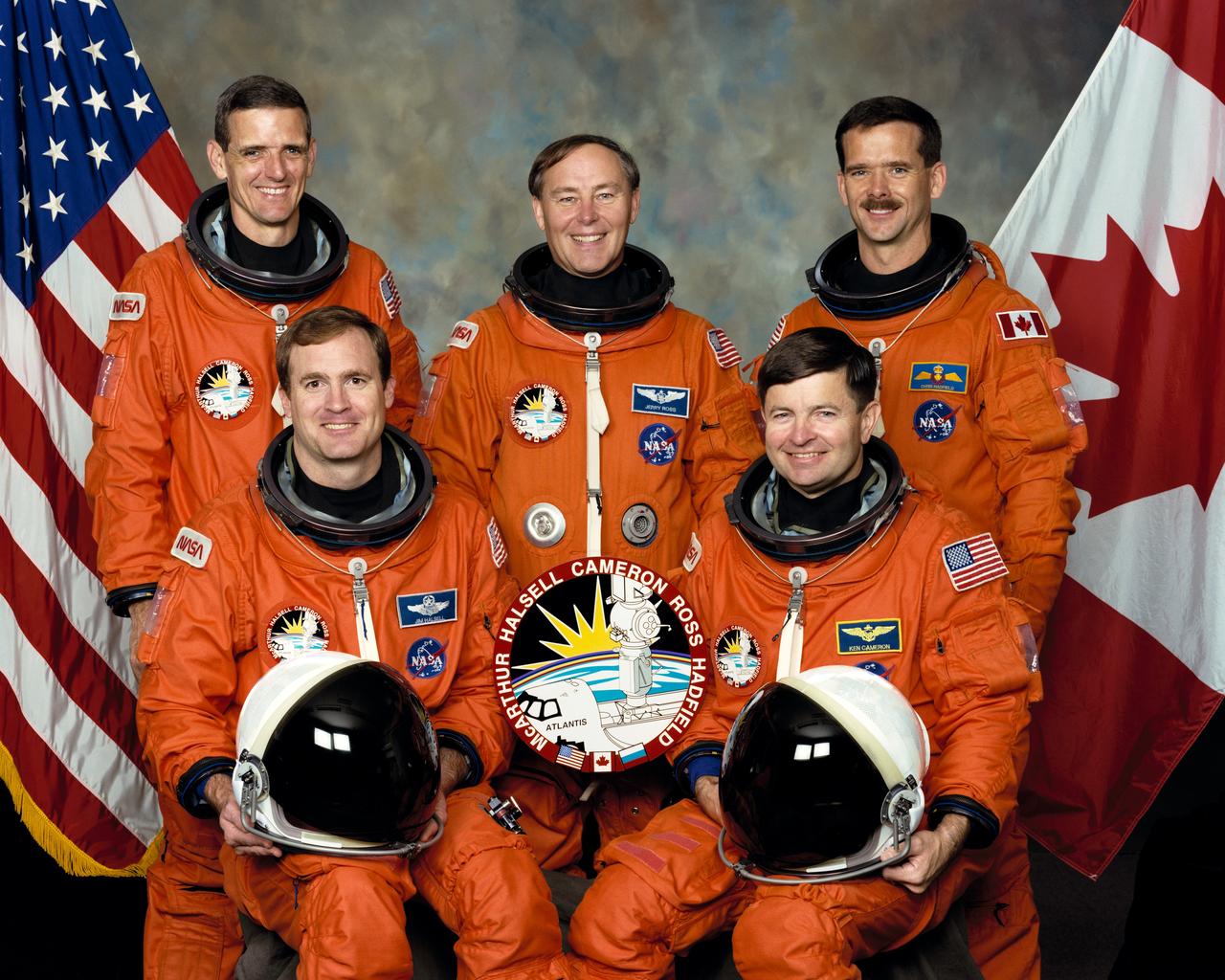 STS074-S-002(August 1995) --- These five NASA astronauts including one Canadian are in training for the STS-74 mission of the Space Shuttle Atlantis, scheduled later this year. Astronauts Kenneth D. Cameron (front right) and James D. Halsell Jr. (front left) are commander and pilot, respectively, for the flight. On the back row, left to right, are astronauts William McArthur Jr., Jerry L Ross and Chris A. Hadfield, all mission specialists. Hadfield is an international mission specialist representing the Canadian Space Agency (CSA).   