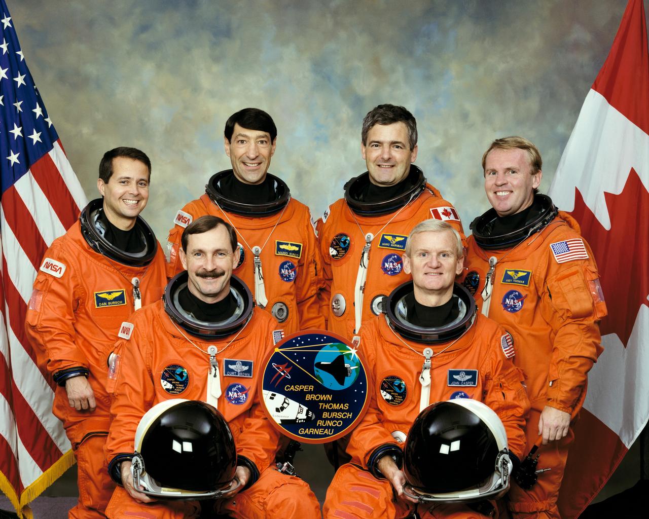 STS077-S-002 (February 1996) --- These six astronauts have been named to fly aboard the Space Shuttle Endeavour in support of the Spacehab-04 mission, scheduled for launch in May of this year.  On the front row are astronauts John H. Casper (right), mission commander; and Curtis L. Brown Jr., pilot.  In the rear, from the left, are astronauts Daniel W. Bursch, Mario Runco Jr., Marc Garneau and Andrew S. W. Thomas, all mission specialists.  Garneau represents the Canadian Space Agency (CSA).