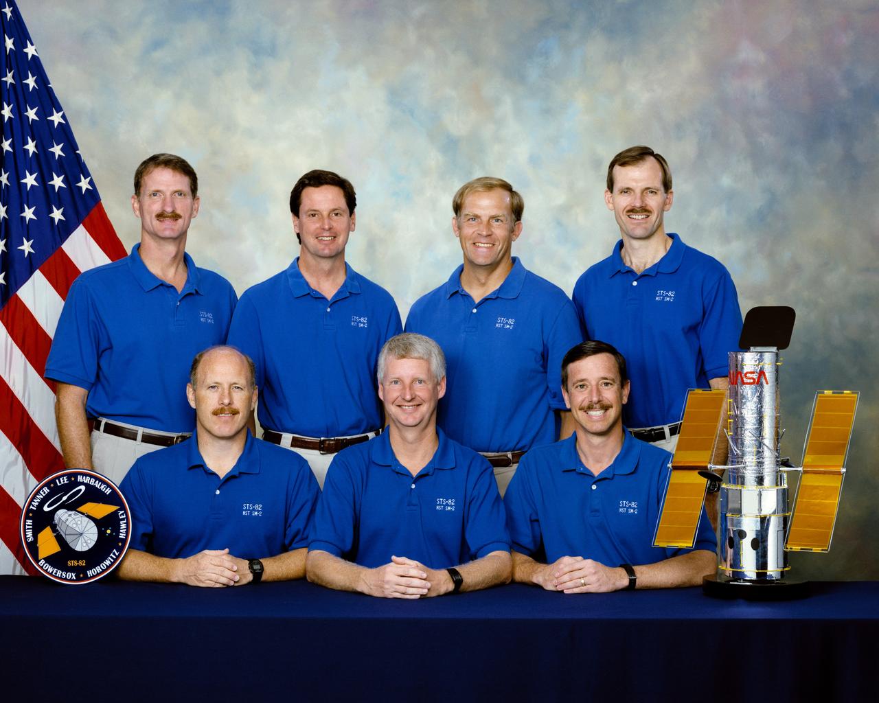 STS082-S-002 (December 1996) --- These seven astronauts are prime crew members for NASA&#0146;s STS-82 mission. They are, on the front row, from the left, Kenneth D. Bowersox, Steven A. Hawley and Scott J. Horowitz. On the back row are Joseph R. Tanner, Gregory J. Harbaugh; Mark C. Lee and Steven L. Smith.  Bowersox and Horowitz are commander and pilot, respectively, with Lee assigned as payload commander. Hawley, Harbaugh, Smith and Tanner are mission specialists. The seven are pictured with a small model of the Hubble Space Telescope (HST), which they will be paying a visit representing the second HST maintenance mission.  Bowersox was pilot for the STS-61 mission, which performed the first maintenance on HST. Hawley was a mission specialist on STS-31, the mission whose astronauts originally deployed the HST.
