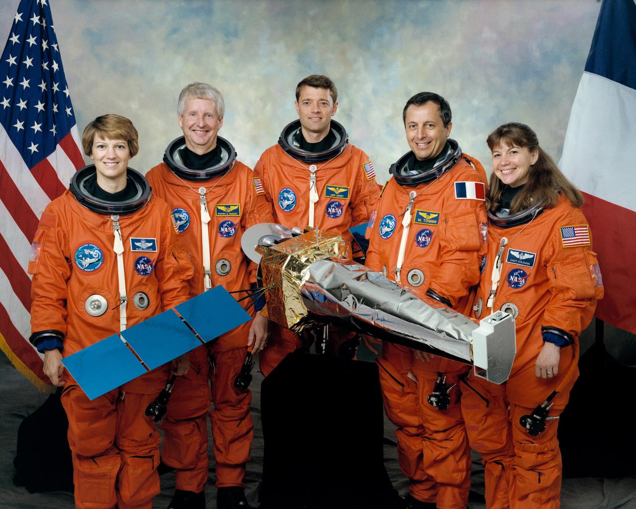 STS093-S-002 (September 1998) --- The five astronauts assigned to fly aboard the Space Shuttle Columbia early next year for the STS-93 mission pose with a small model of their primary payload-the Advanced X-ray Astrophysics Facility (AXAF). From the left are astronauts Eileen M. Collins, mission commander; Steven A. Hawley, mission specialist; Jeffrey S. Ashby, pilot; Michel Tognini and Catherine G. Coleman, both mission specialists. Tognini represents France's Centre National d'Etudes Spatiales (CNES). The scheduled five-day mission will feature the deployment of AXAF, which will enable scientists to conduct comprehensive studies of exotic phenomena in the universe. Among bodies studied will be exploding stars, quasars and black holes.