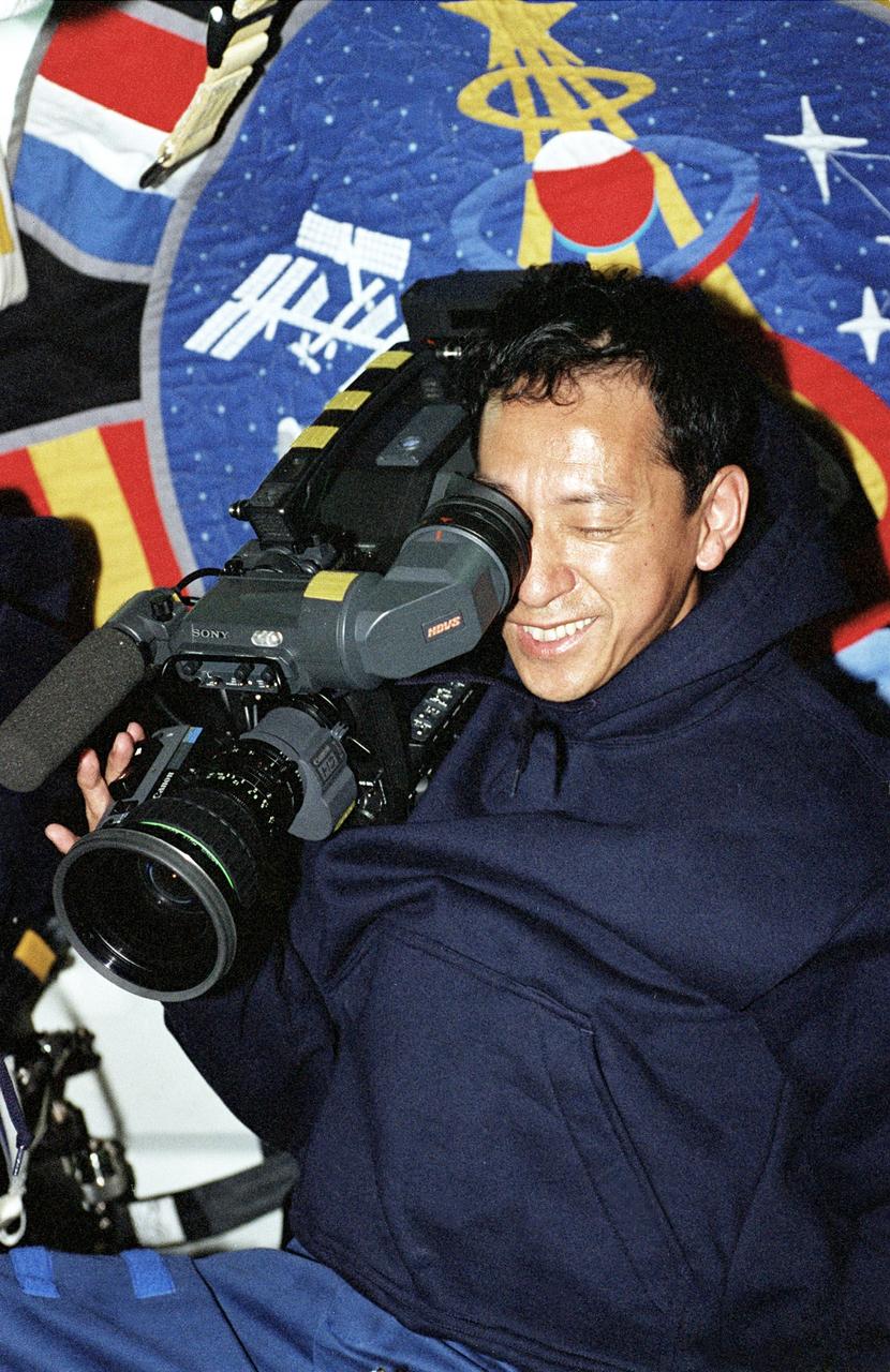 STS099-313-010 (11-22 February 2000) ---  Astronaut Mamoru Mohri, mission specialist, uses the High Definition Television (HDTV) camera on Endeavour's  mid deck. The National Space Development Agency's (NASDA) astronaut supported the Blue Team during the SRTM flight.