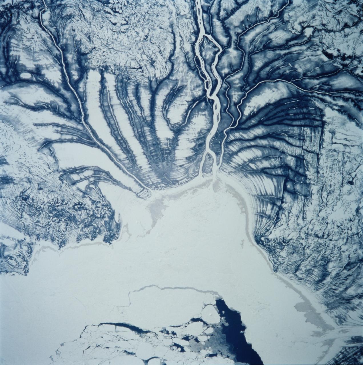 STS099-706-090 (11-22 February 2000) ---One of the astronauts aboard the Space Shuttle Endeavour for the STS-99 mission recorded this 70mm image of Hannah Bay, in the southern part of St. James Bay.  The river is the Harricanaw River.  Numerous shorelines around Hudson and St. James Bays are distinctive in winter because of snow cover.  According to NASA scientists, shorelines were created when the overlying glaciers retreated and the land underneath rebounded causing the Hudson and St. James Bay waters to retreat northward.  These ridges are 100 to 200 meters in width and heights can reach up to 7 meters.  The land along St. James Bay consists mainly of tidal flats and salt marshes.