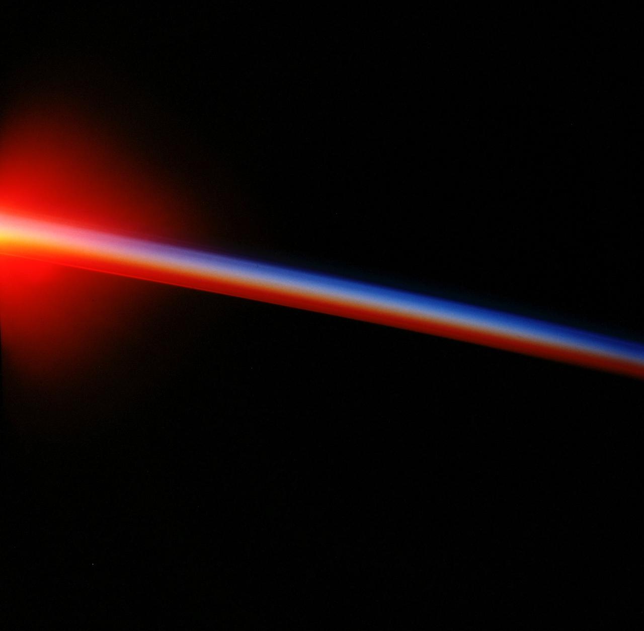 STS099-734-012 (11-22 February 2000) ---As photographed by one of the STS-99 crew members aboard the Space Shuttle Endeavour, a shallow atmosphere displays the various layers by color. The layer that holds the gases we breathe are under the yellow band called the tropopause.