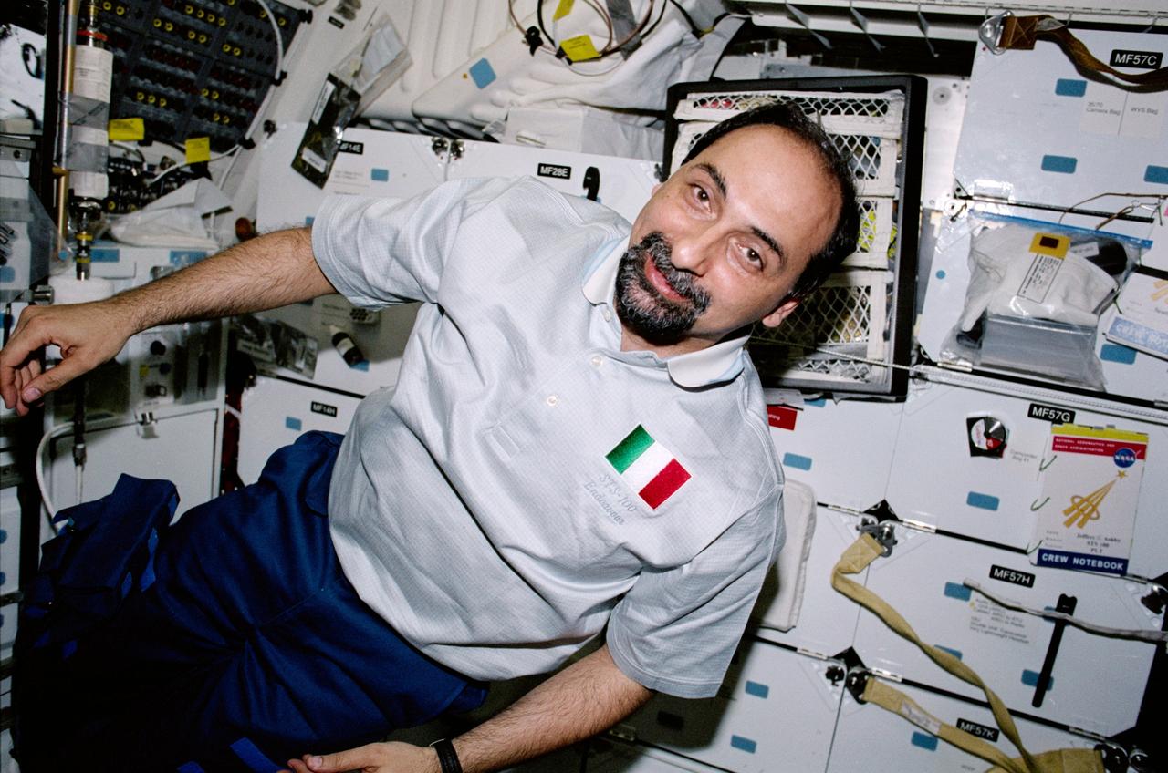 STS100-342-031 (19 April-1 May 2001) --- Astronaut Umberto Guidoni, STS-100 mission specialist representing the European Space Agency (ESA), is photographed while on the middeck of the Earth-orbiting Space Shuttle Endeavour.
