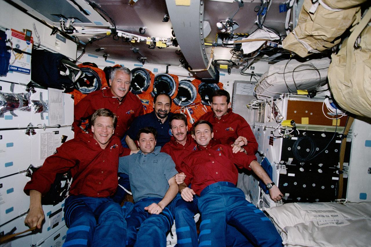 The STS-100 crew pose for their inflight crew photograph on the middeck of Endeavour, Orbiter Vehicle (OV) 105, during the STS-100 mission. Front row from left to right are: Mission Specialist (MS) Scott E. Parazynski, Pilot Jeffrey S. Ashby, Commander Kent V. Rominger and MS / Cosmonaut Yuri V. Lonchakov. Back row: MS John L. Phillips, MS Umberto Guidoni and MS Chris A. Hadfield. Lonchakov represents Rosaviakosmos. Guidoni represents European Space Agency (ESA). Hadfield represents Canadian Space Agency (CSA). This image was selected by the STS-100 crew for use in public presentations.