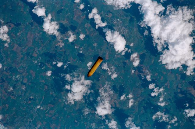 NASA image: The external tank from STS-102 falls to Earth