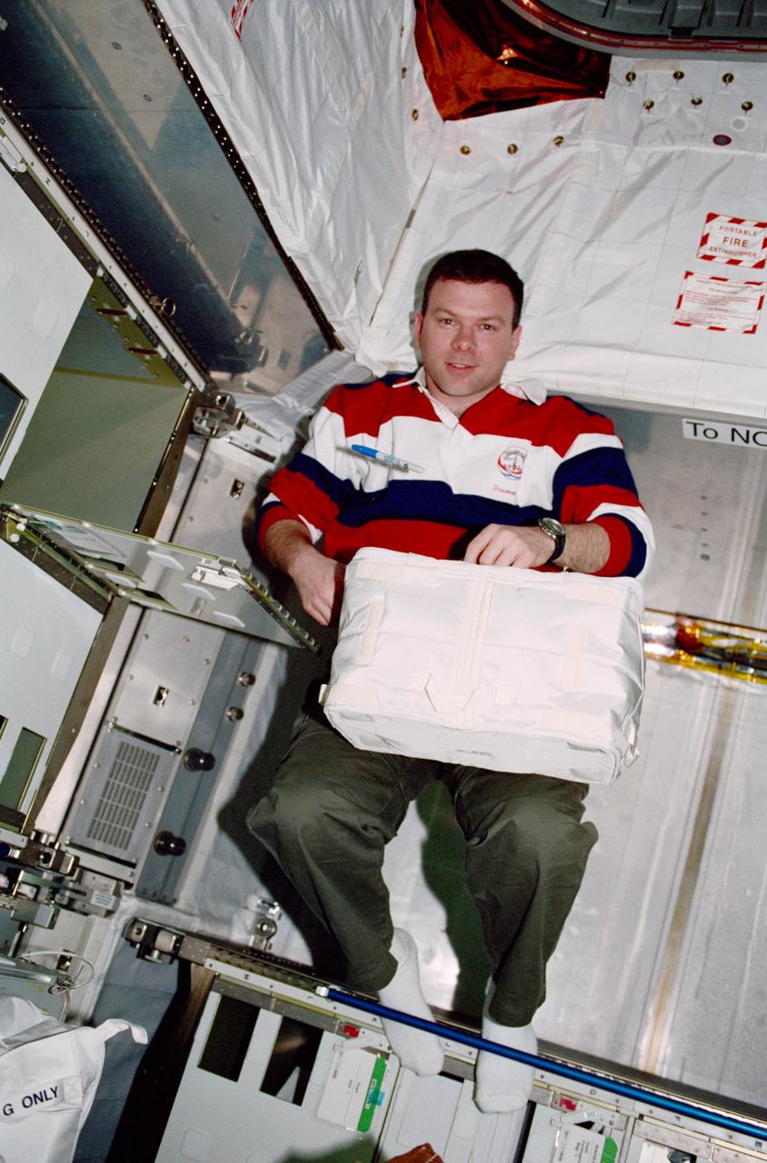 STS102-319-024 (8-21 March 2001) --- Astronaut James W. Kelly, STS-102 pilot, is photographed inside Leonardo, the Italian Space Agency-built Multi-Purpose Logistics Module (MPLM). Leonardo is the first of three such pressurized modules that will serve as the International Space Station’s (ISS) “moving vans”, carrying laboratory racks filled with equipment, experiments and supplies to and from the station aboard the space shuttle.