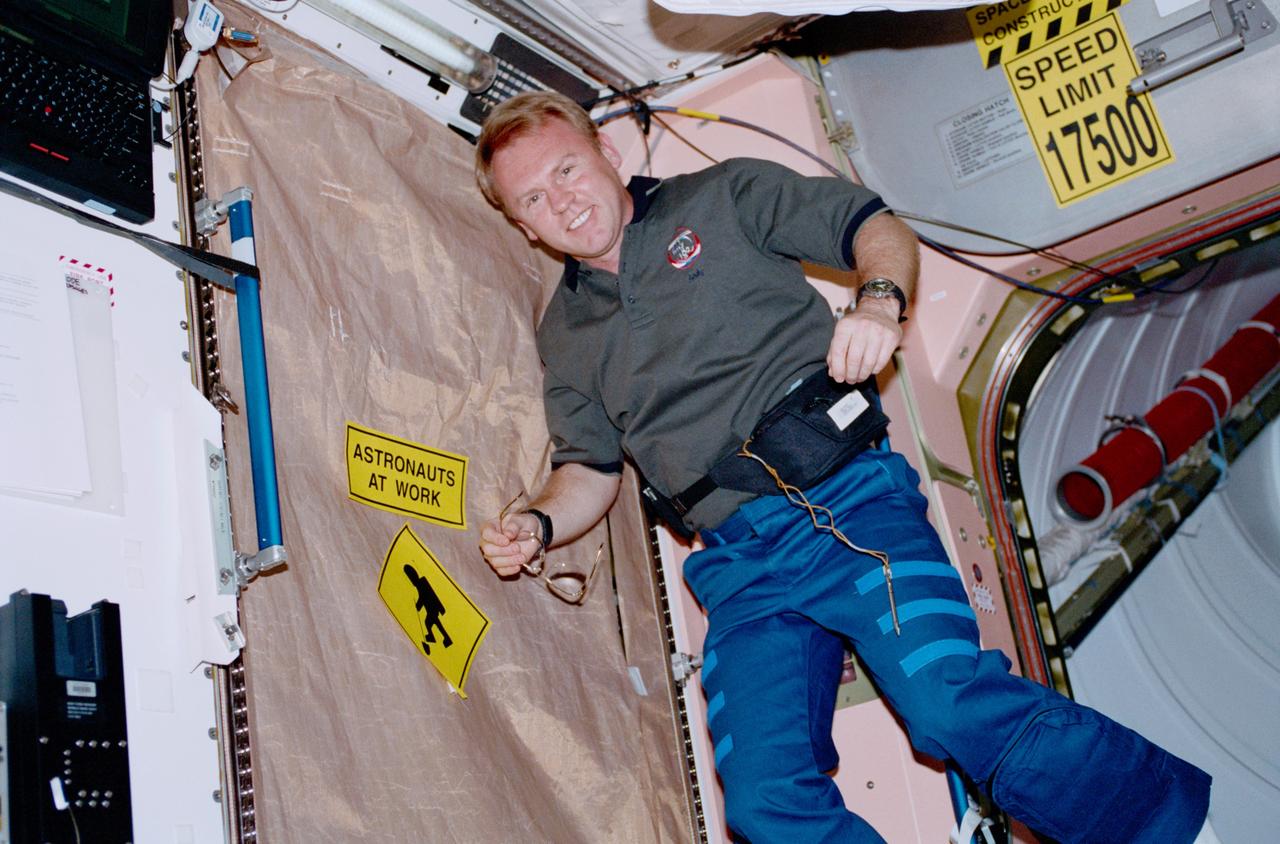 STS102-320-035 (8-21 March 2001) --- Astronaut Andrew S. W. Thomas, mission specialist, is photographed in the U.S.-built Unity node of the International Space Station during the STS-102 mission.