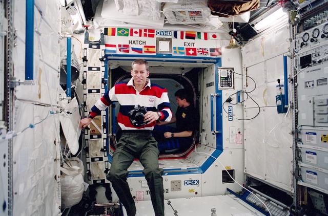 NASA image: Wetherbee takes a photo in the ISS U.S. Laboratory