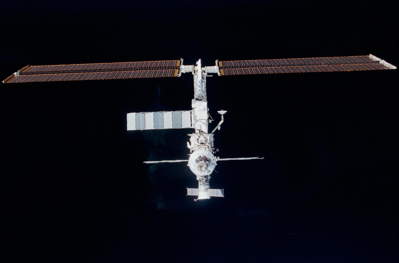 STS102-326-034 (10 March 2001) --- Backdropped against the blackness of space, the International Space Station (ISS) is lined up for rendezvous with the Space Shuttle Discovery. One of the astronauts aboard Discovery took this 35mm photograph from the aft flight deck.