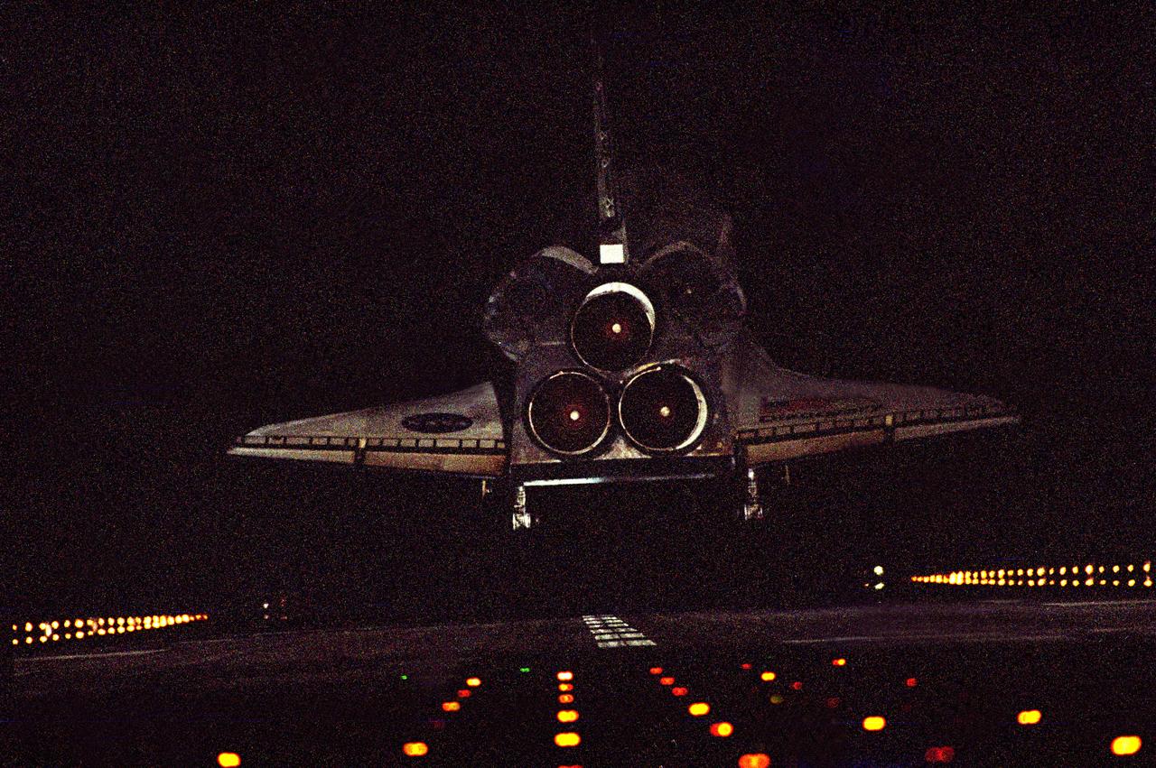 STS102-S-015 (21 March 2001)--- After a 5.3 million mile mission, The Space Shuttle Discovery approaches touchdown on Runway 15 at the KSC Shuttle Landing Facility in this aft view. The landing completed the successful 12-day STS-102 mission. Onboard the shuttle were astronauts James Wetherbee, James Kelly, Andy Thomas, and Paul Richards. Discovery’s touchdown also marked the return of the space station’s first resident crew – Expedition One which were William Shepherd, Yuri Gidzenko and Sergei Krikalev. STS-102 was the 103rd shuttle flight and the eighth shuttle mission to visit the station.