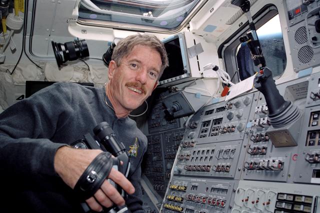 NASA image: MS Reilly on flight deck with video camera