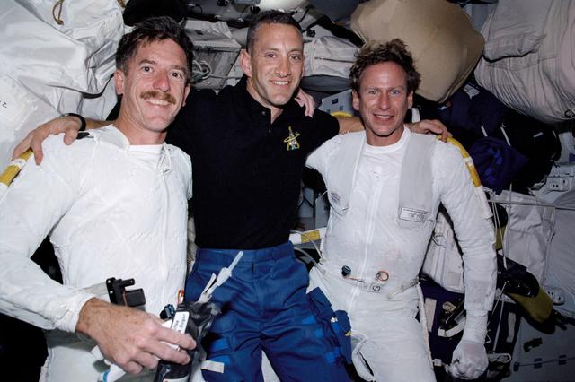 NASA image: STS-104 PLT Hobaugh with EVA crew MS Reilly and Gernhardt after EVA 1
